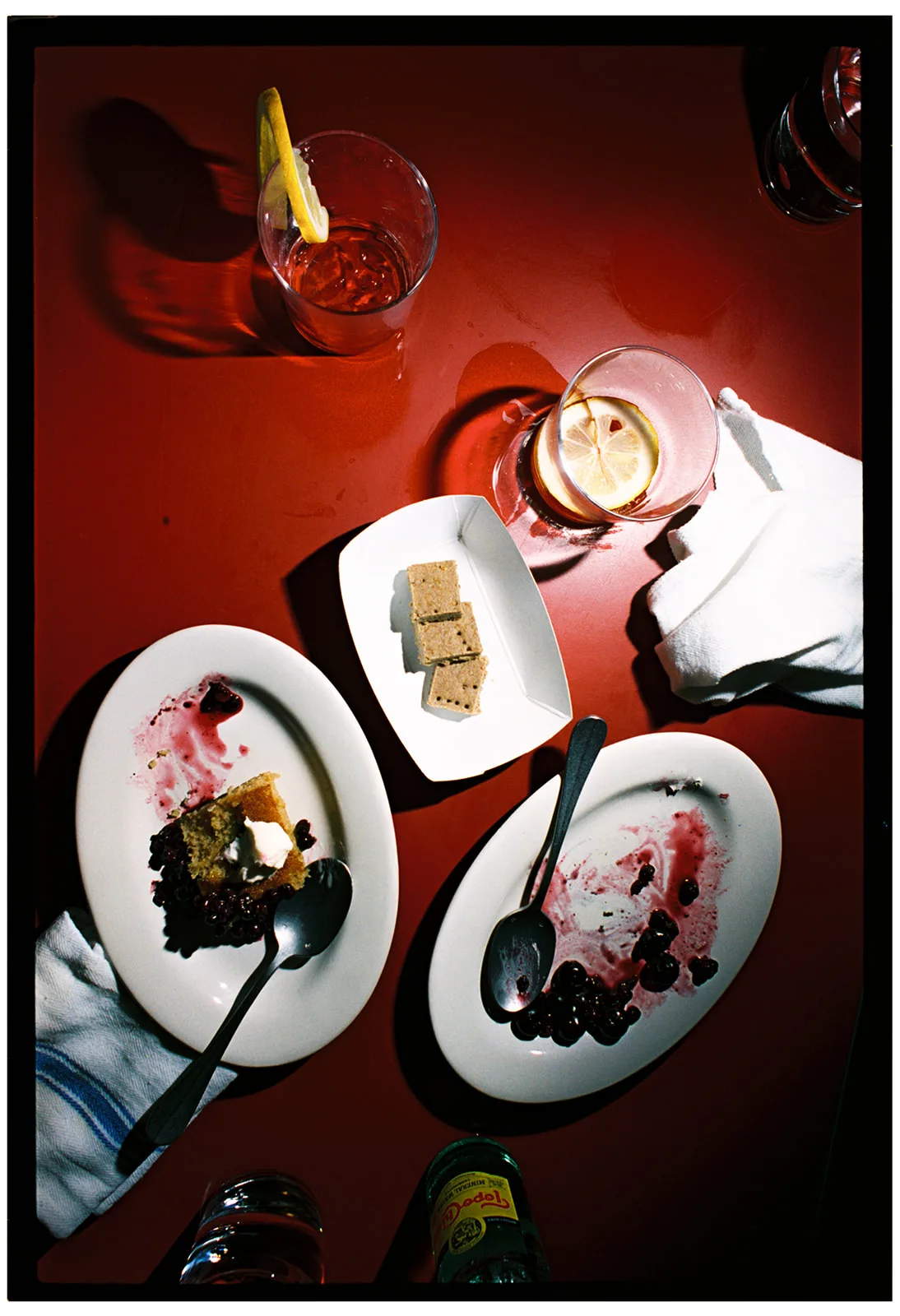 Overhead view of dessert plates and cocktails at Monday Night Dinner